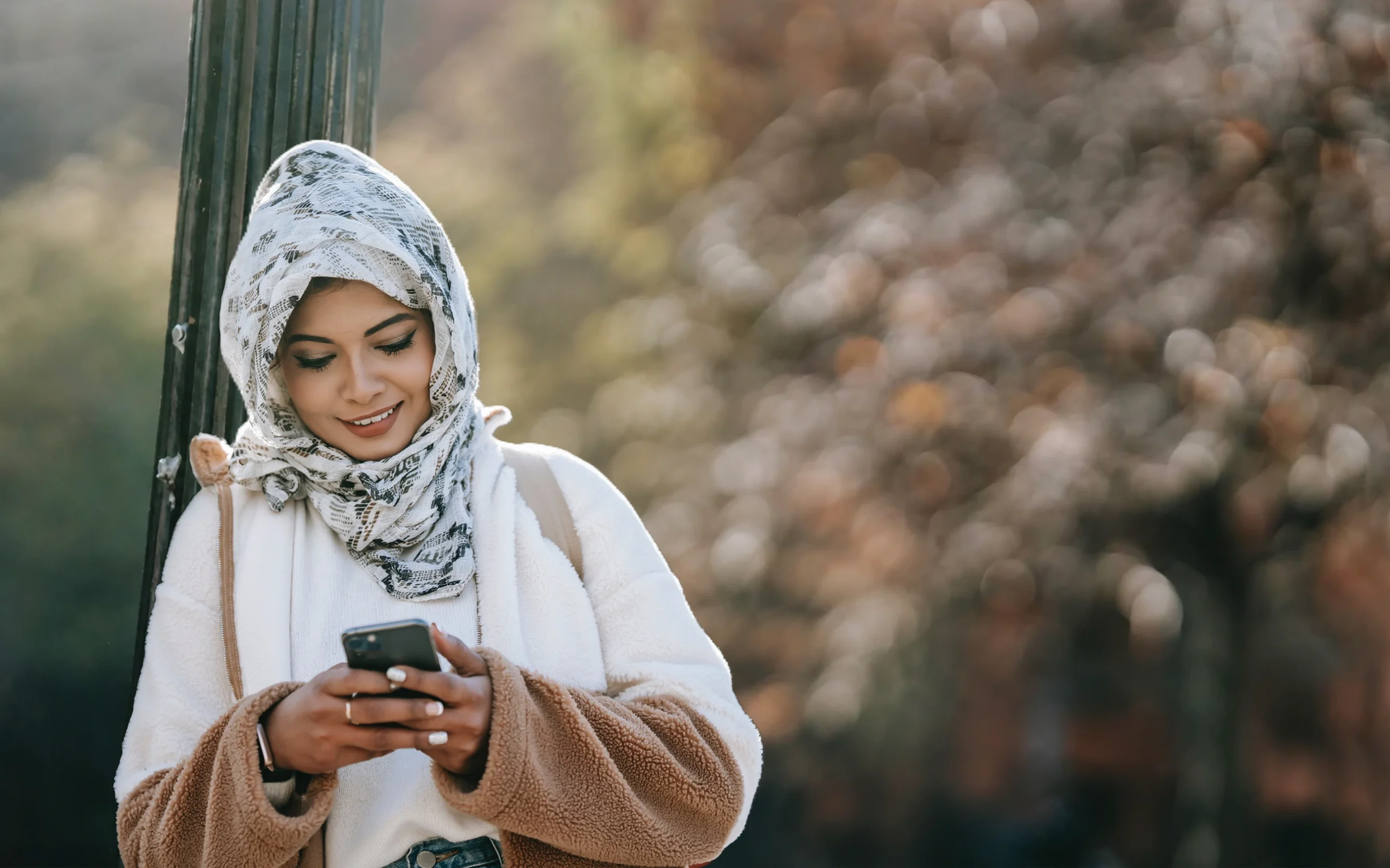 A woman enjoying a quiet moment with her phone